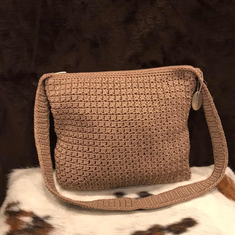 Women’s soft, hand-woven, taupe, shoulder bag, with lining, and zipper pocket.